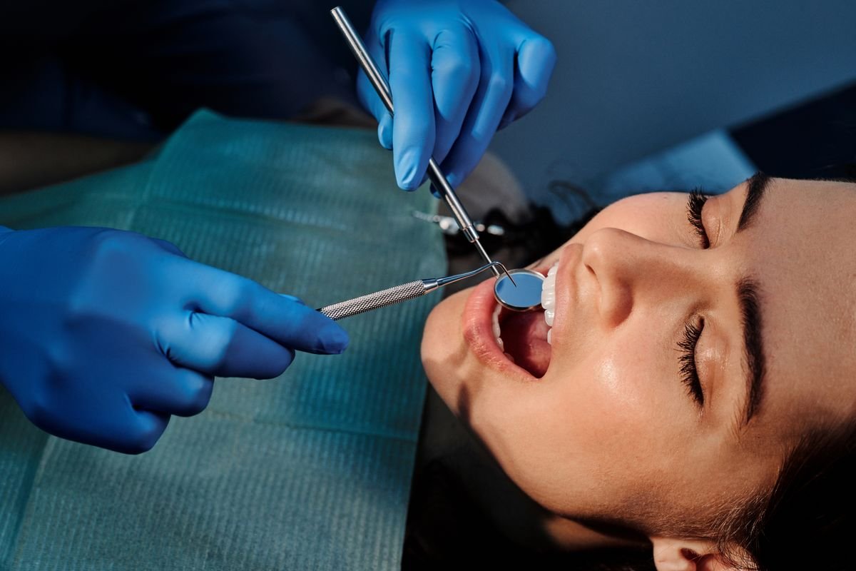 Dentist performing gentle root canal therapy on a patient in Aurora
